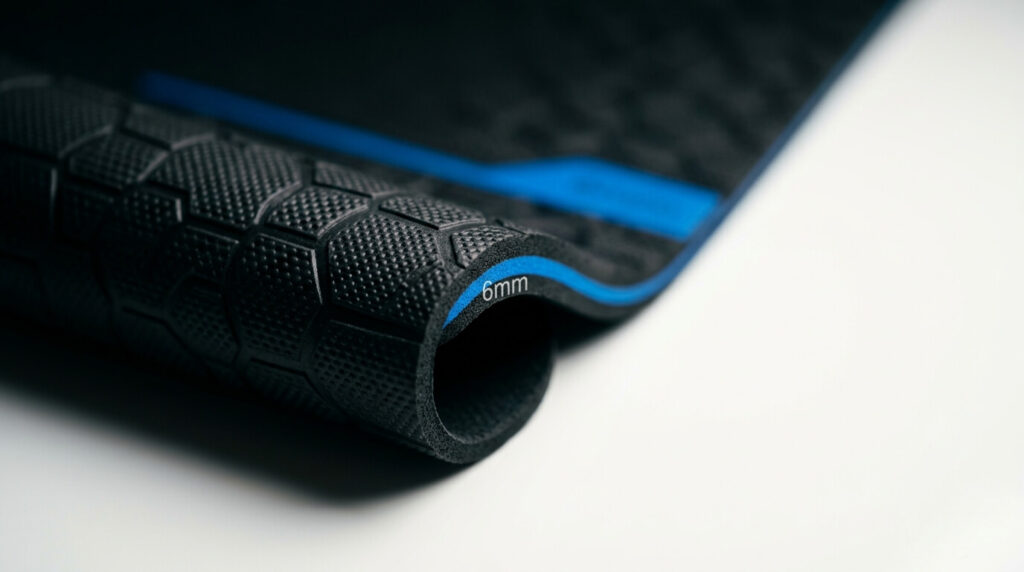 Close-up view of 6mm thick yoga mat showing anti-slip textured surface and cushioning